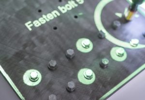 Projected augmented reality guiding torque sequence