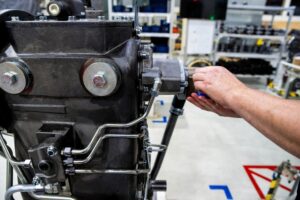 Manufacturer assembling tractor transmission